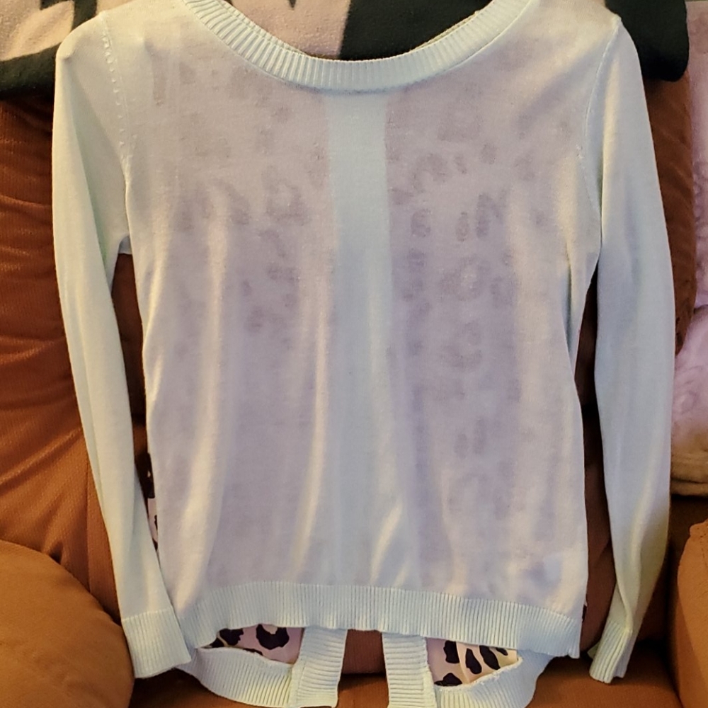 Sheer sweater with leopard pattern on back